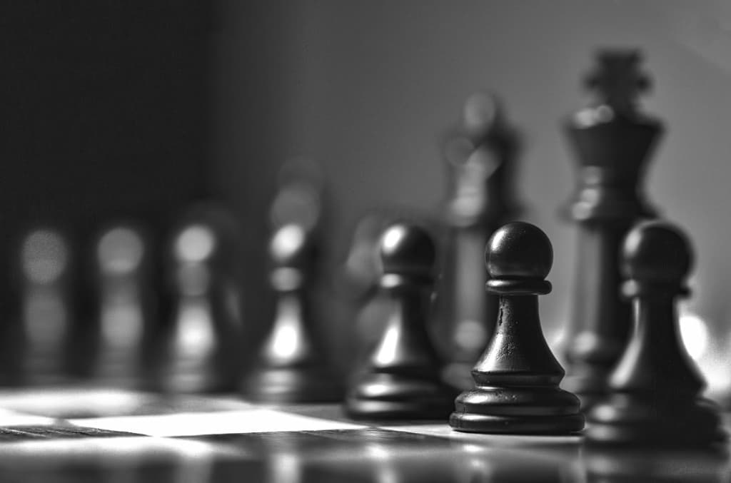 Black and white chess pieces on a board