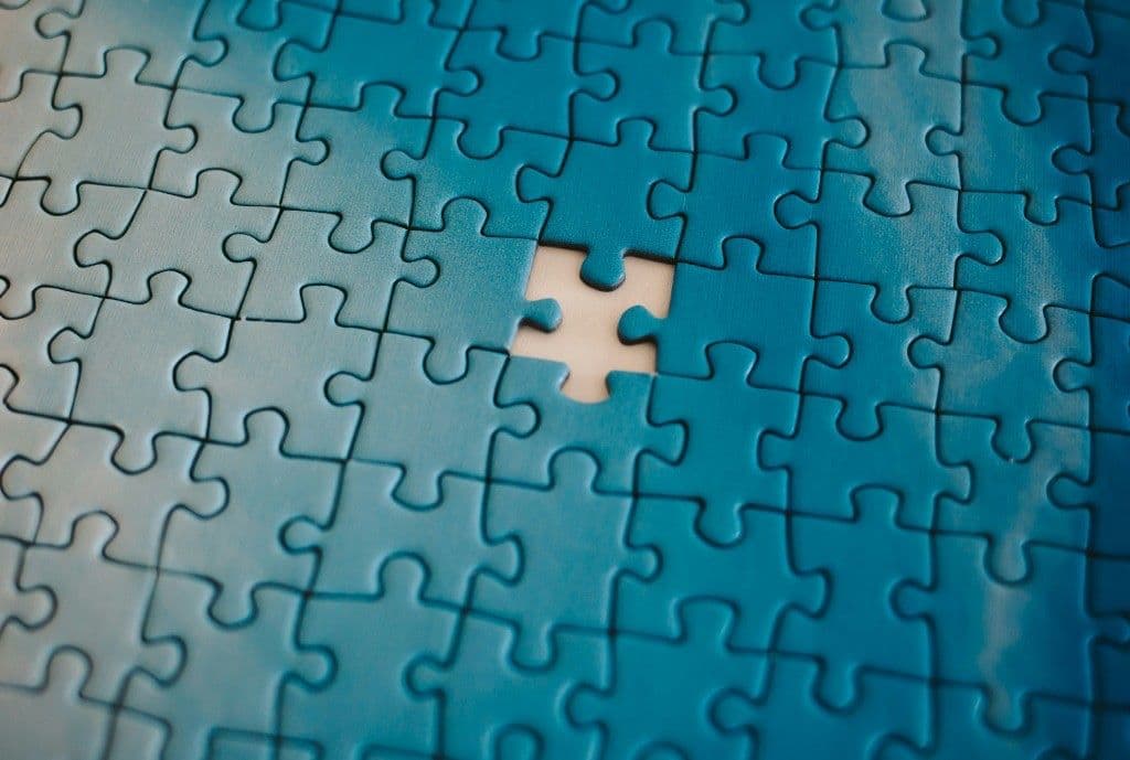Jigsaw puzzle with one missing piece, suggesting M&A integration